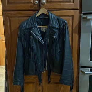 Vintage woman’s leather jacket. Not perfect condition, but good considering age.